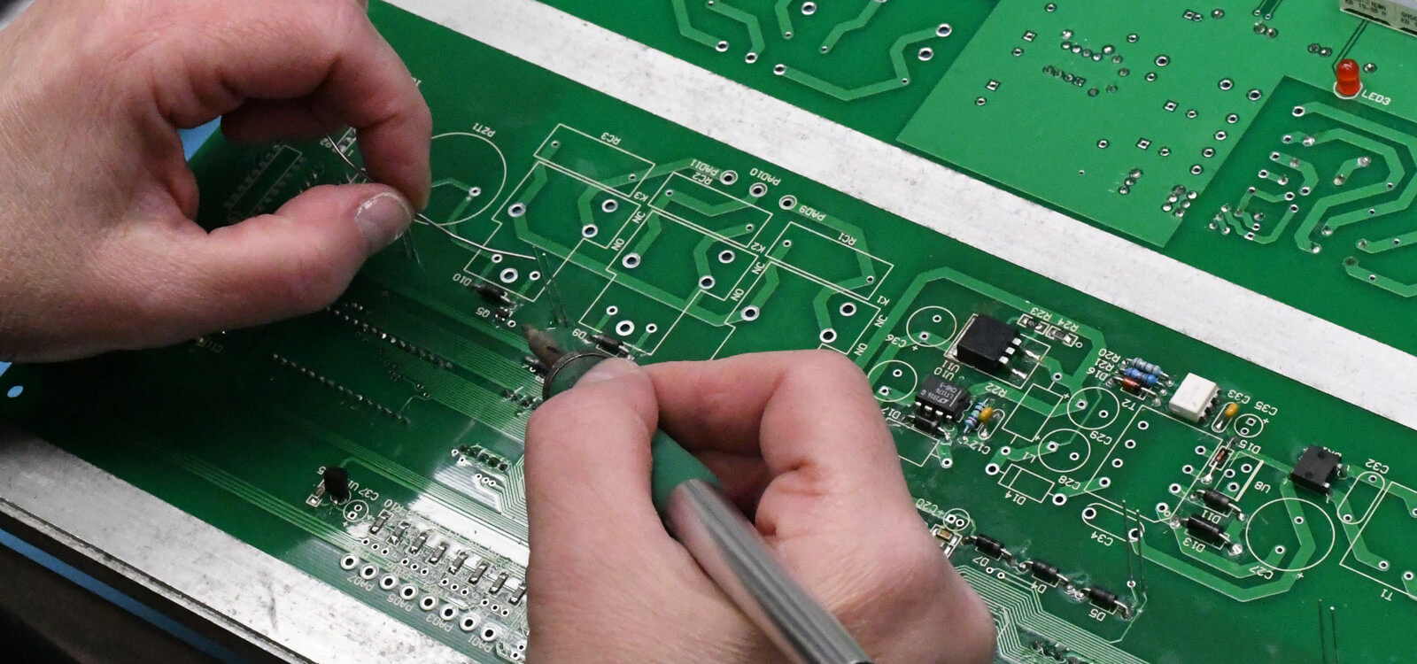 Hand soldering a circuit board
